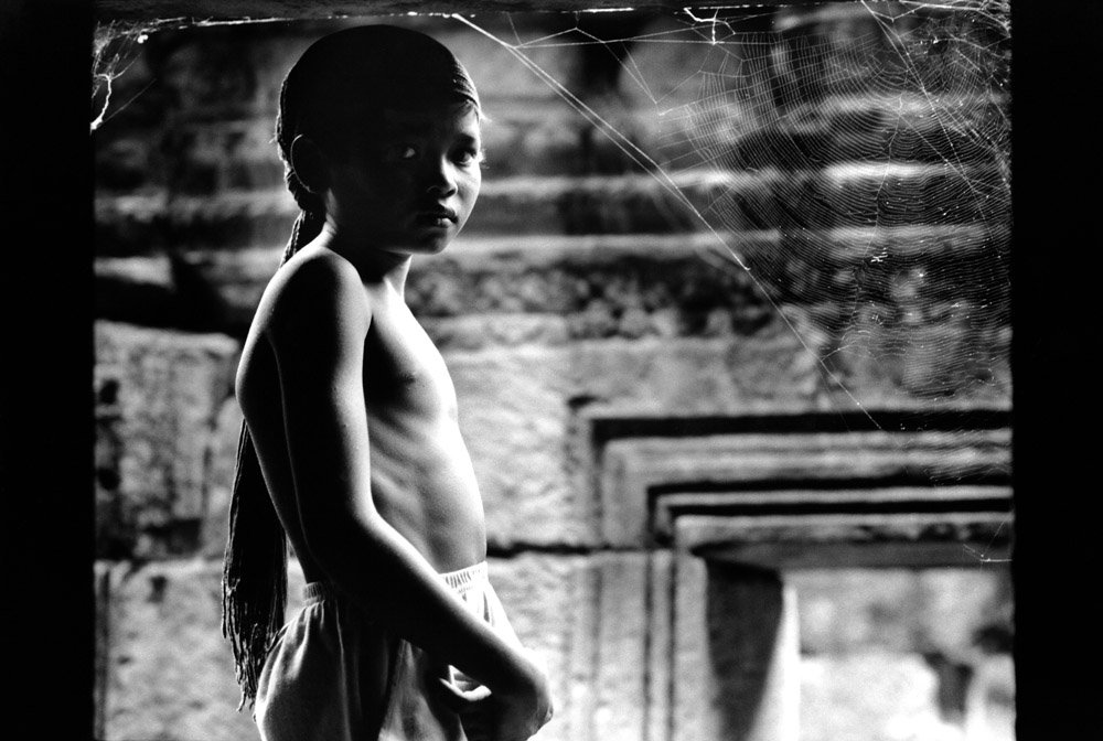 Spiderwebs inside Preah Khan. Angkor, Cambodia 1997 - © Carlo Sacco