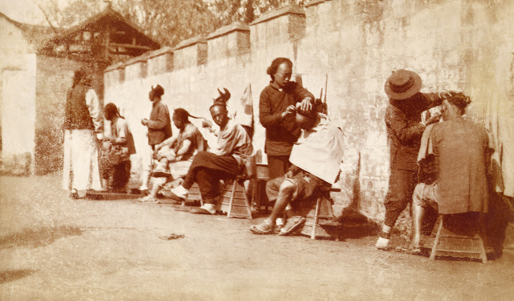 Street barbers. Place and photographer unknown, Albumen 1900