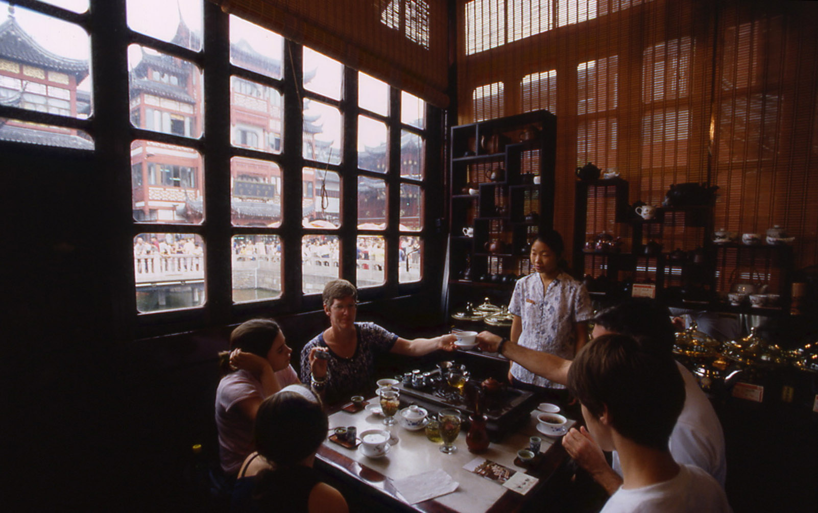 Tourists inside historical tea house. Shanghai, China  2005 - © Carlo Sacco