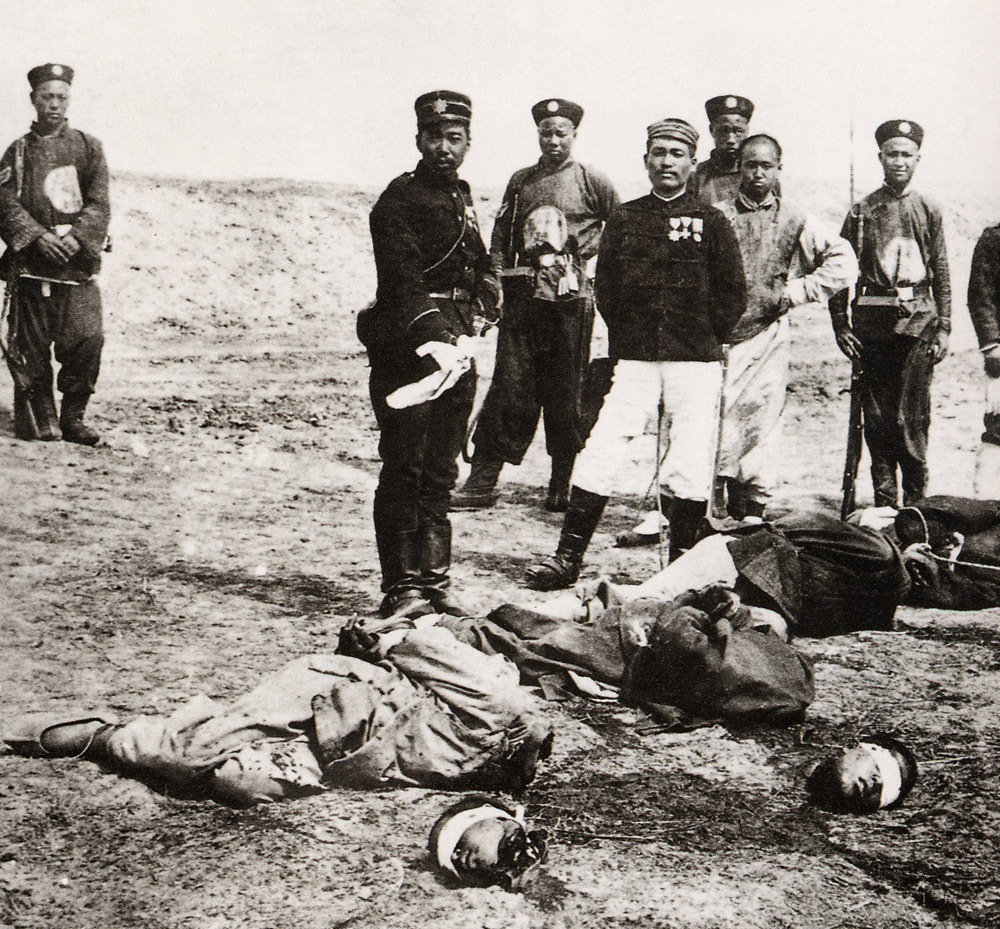 Japanese troops and Imperial guards at boxer executions at An Ding Men Gate in Beijing