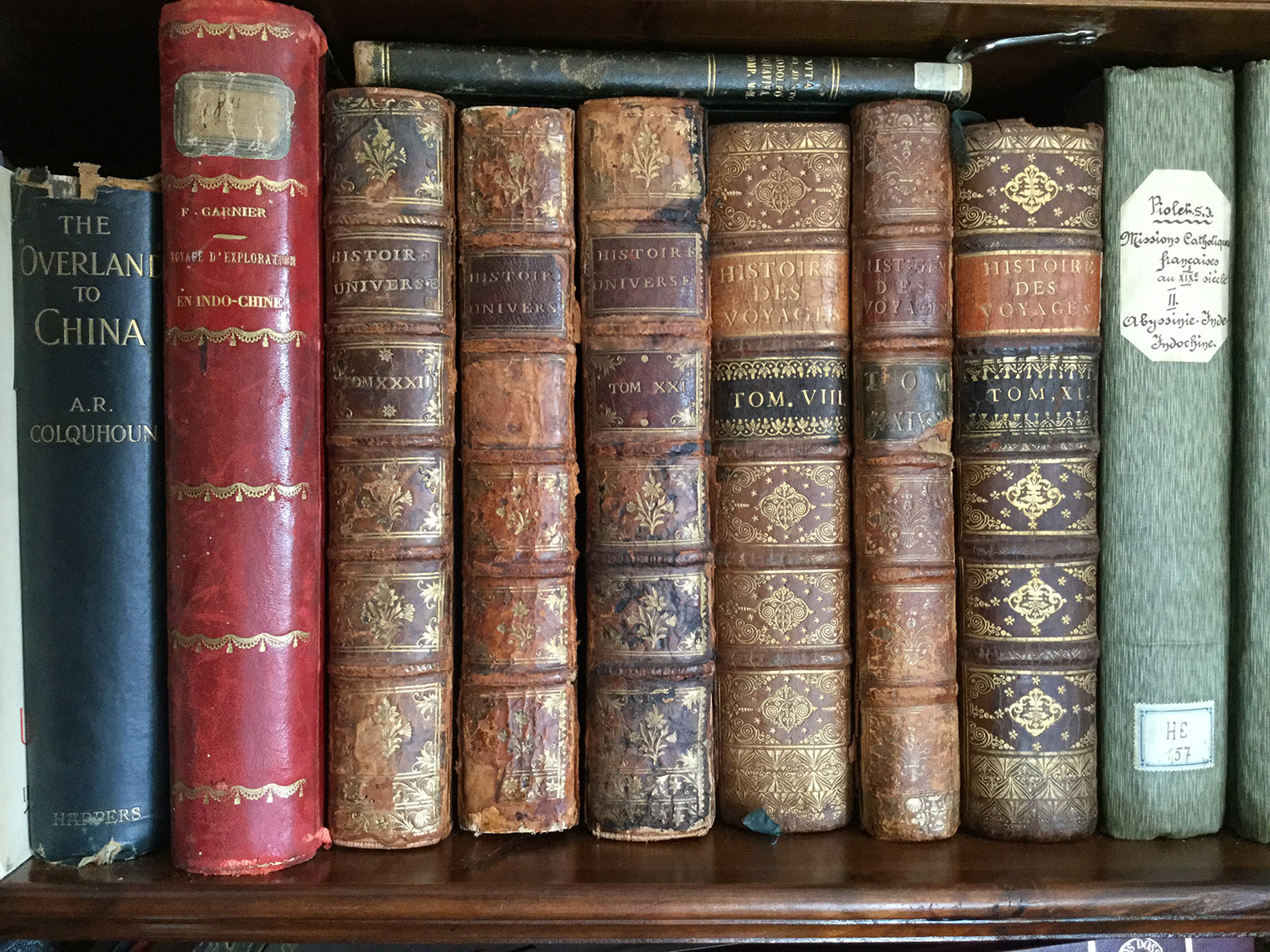 Historical volumes of Histoire des Voyages and Volume owned and signed  by Tiziano Terzani titled  The Overland to China.