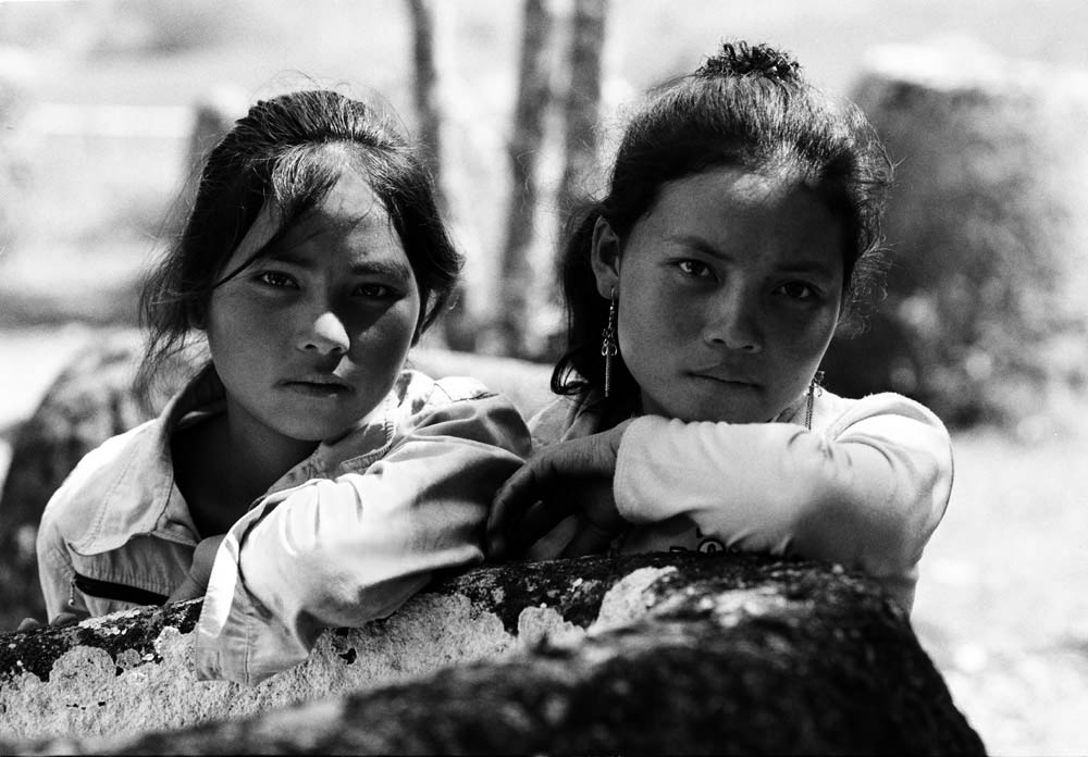 Yee Yang and Mei Yang on plain of jars. Laos 