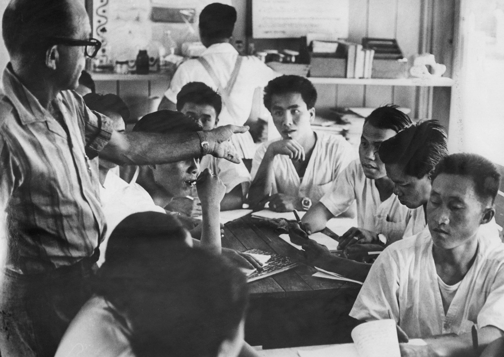 Egar Buell with young Meo male nurse trainers. Laos 1962