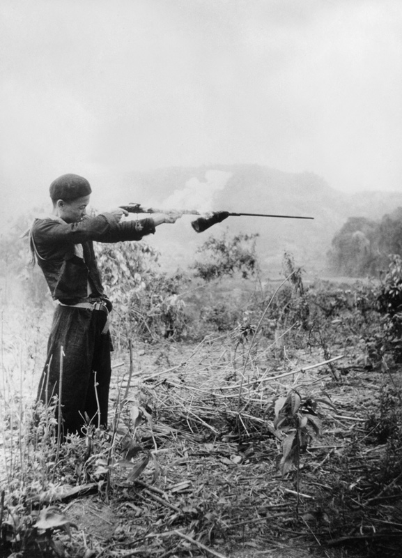 Hmong refugee using home-made musket. Laos 1970