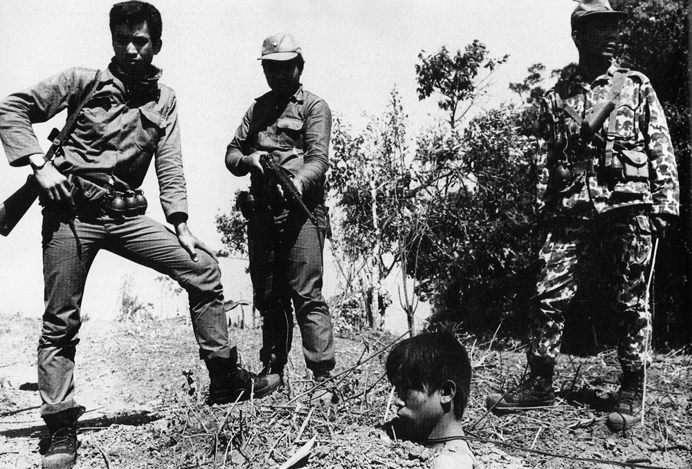 Summary justice for a captured Pathet Lao i.e. buried in the earth