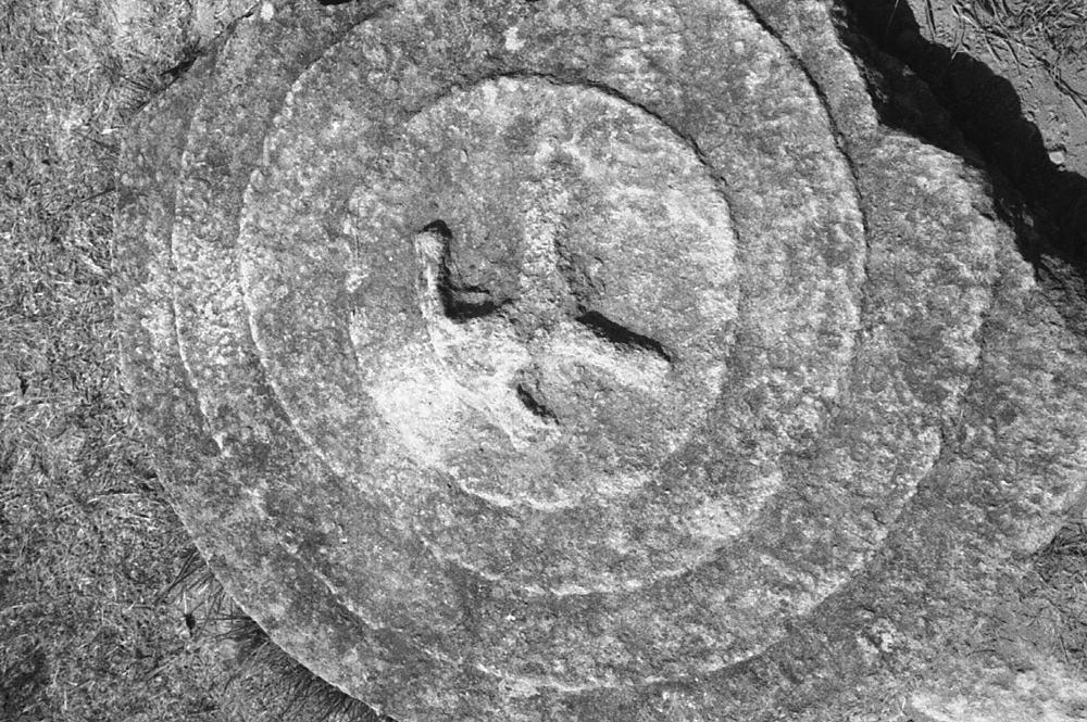 A misterious cover of jar standing on the site no.3, plain of jars. Laos 2008 - © Carlo Sacco