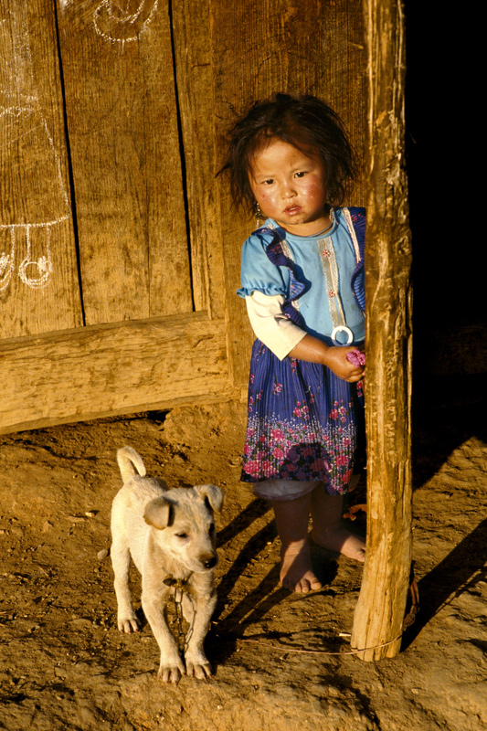 Child with her dog. Ban Sala, Ponsavan, Laos 2008 - © Carlo Sacco