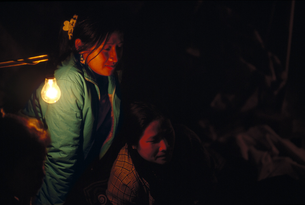 Women selling cloths at Night Market. Luang Prabang, Laos 2008 - © Carlo Sacco