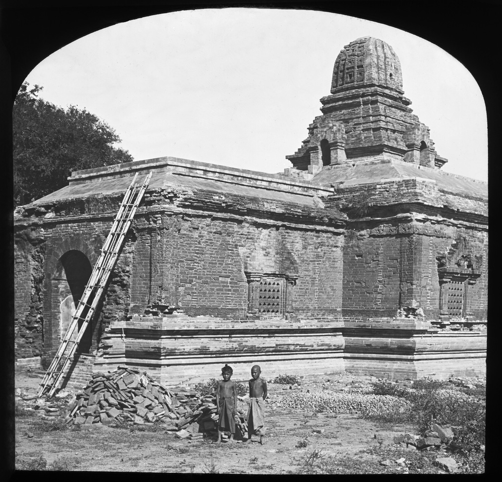 Temple under renovation with two local children. Place unknown. Burma 1910 ca