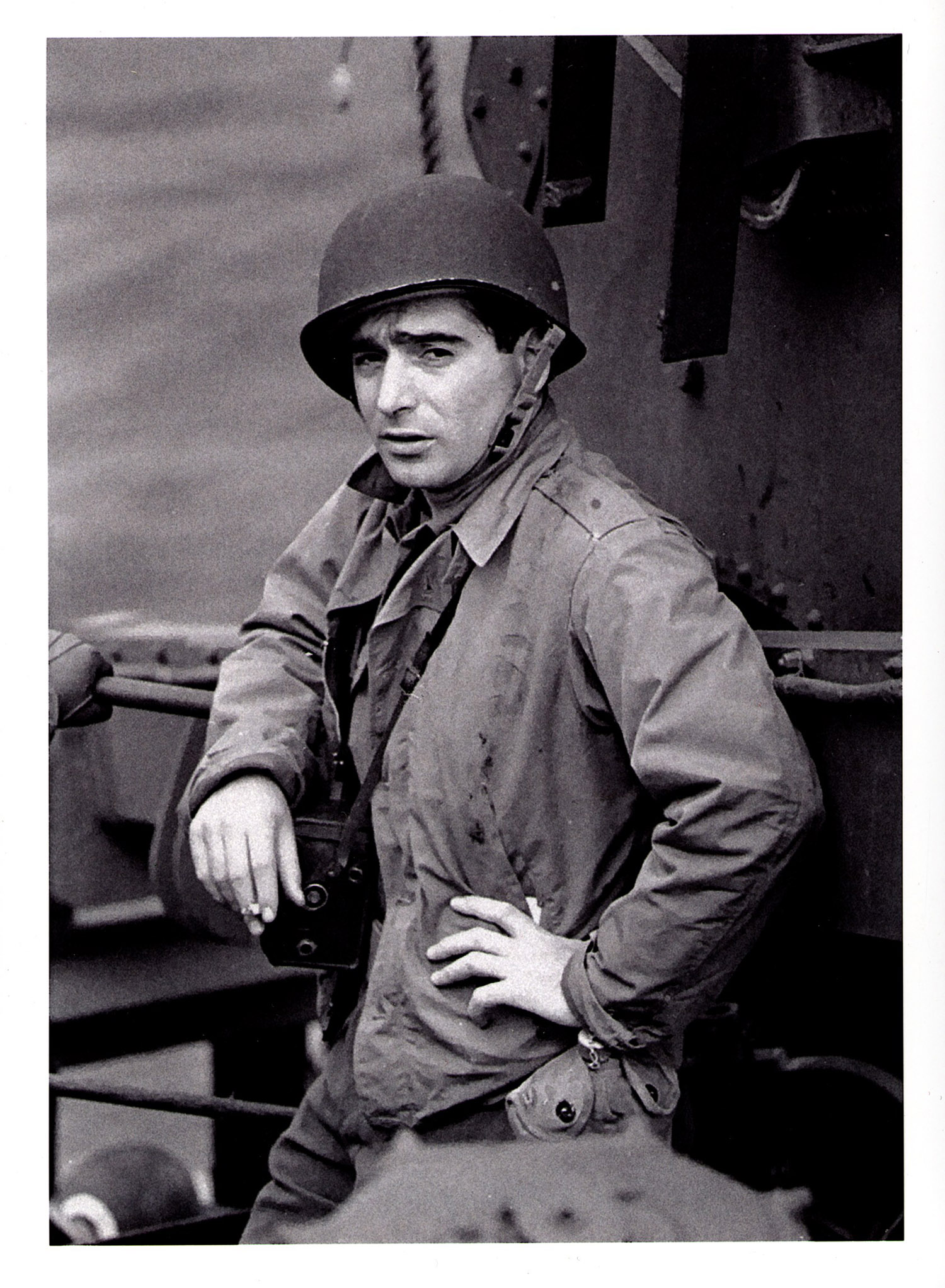 Bob Capa with his Rollei shooted at Portsmouth by David Sherman on the day before the Debarquement in Normandy.  June 1944.Carlo Sacco Collection.
