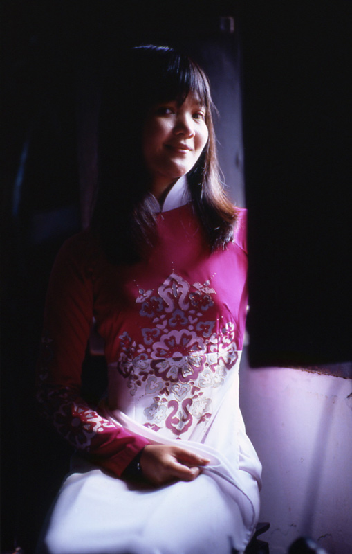 Girl near the window inside old house of Phung Hung no.4., Hoi An, Vietnam 2000 - © Carlo Sacco