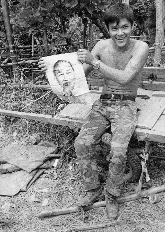 South Vietnamese soldier showing an Ho Chi Minh portrait near Quang Tri