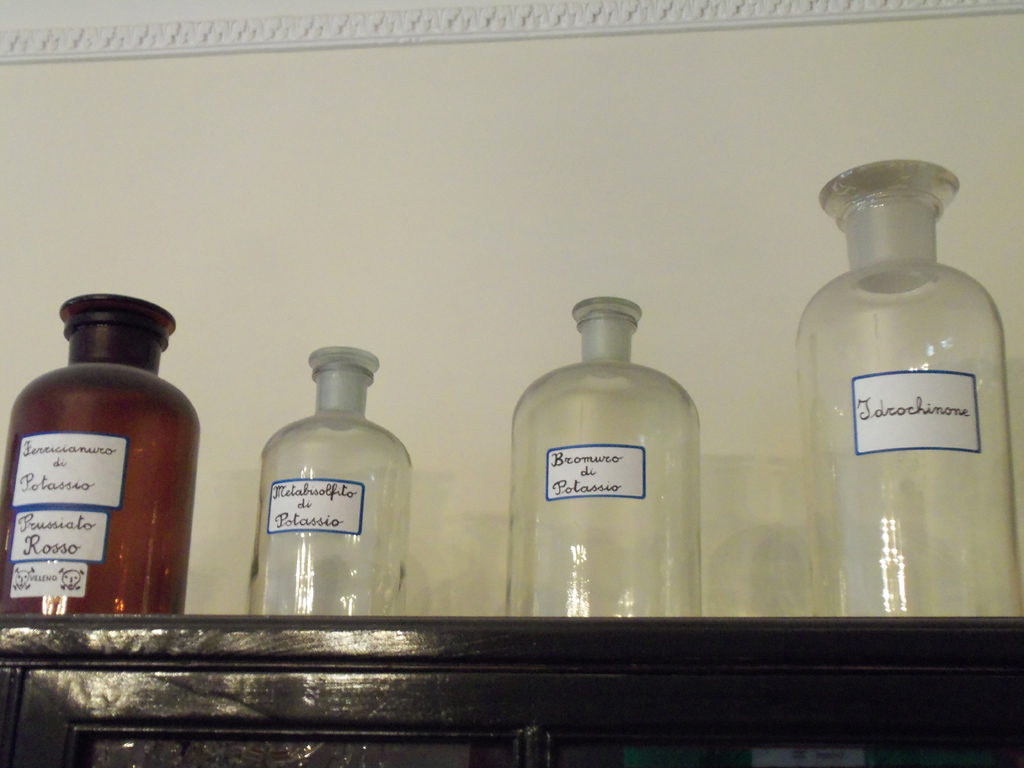 Glass bottles for photographic chemical development products and treatment of glass plates.